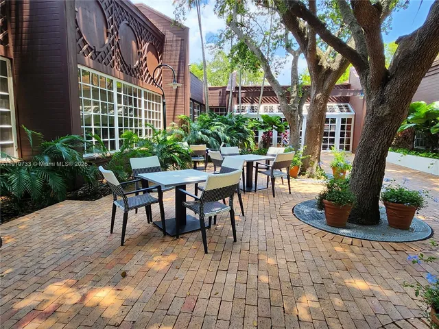 a swimming pool with a outdoor seating