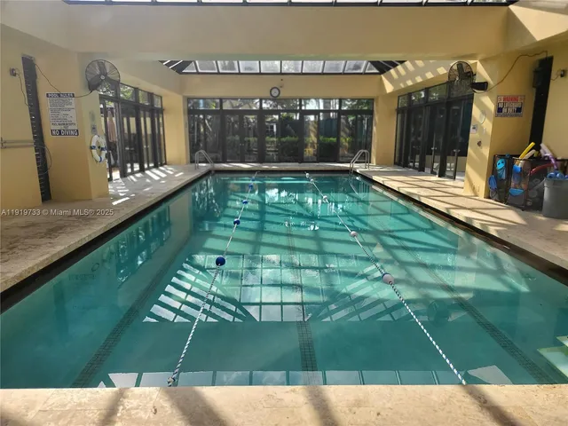 a view of a patio with swimming pool