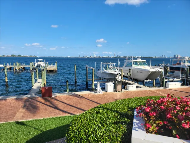 a aerial view of multiple houses with a yard