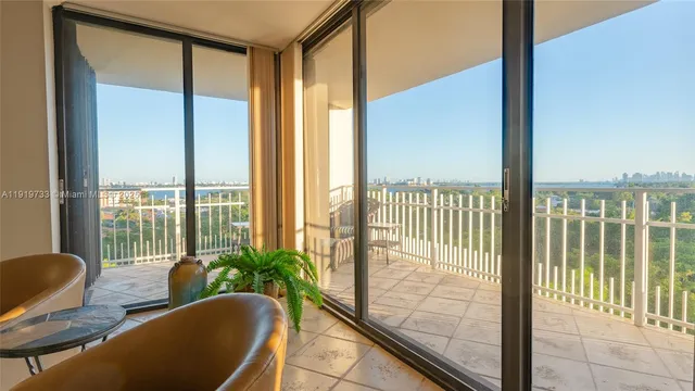 a living room with furniture and a painting