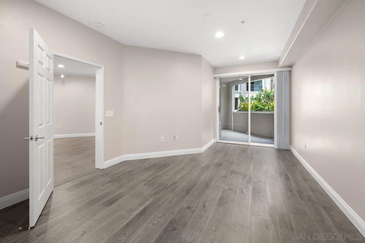 9229 Regents Road, Unit L124 La Jolla, CA 92037 - Photo 13 of 46 wooden floor in an empty room with a window