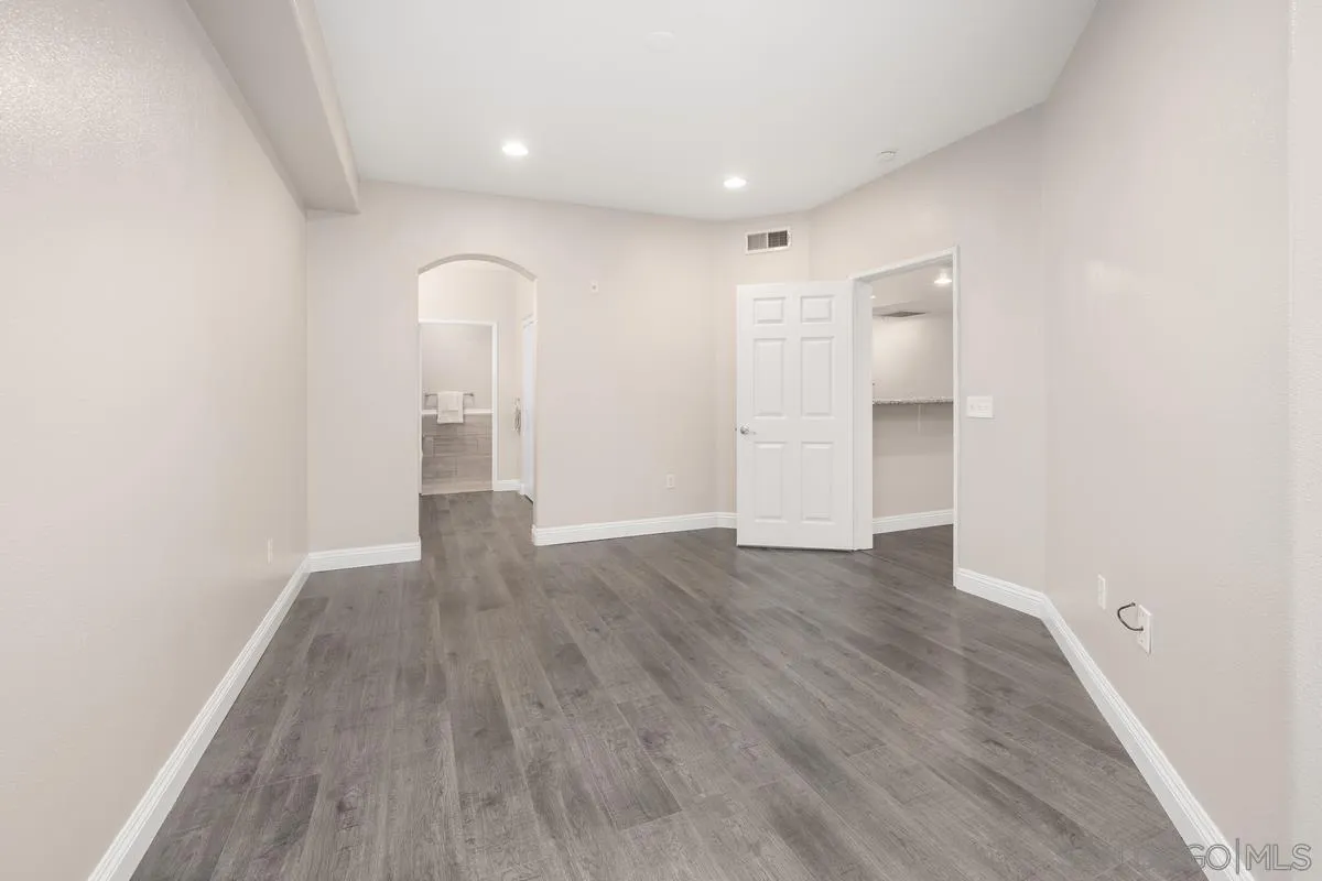 9229 Regents Road, Unit L124 La Jolla, CA 92037 - Photo 15 of 46 a view of empty room with wooden floor