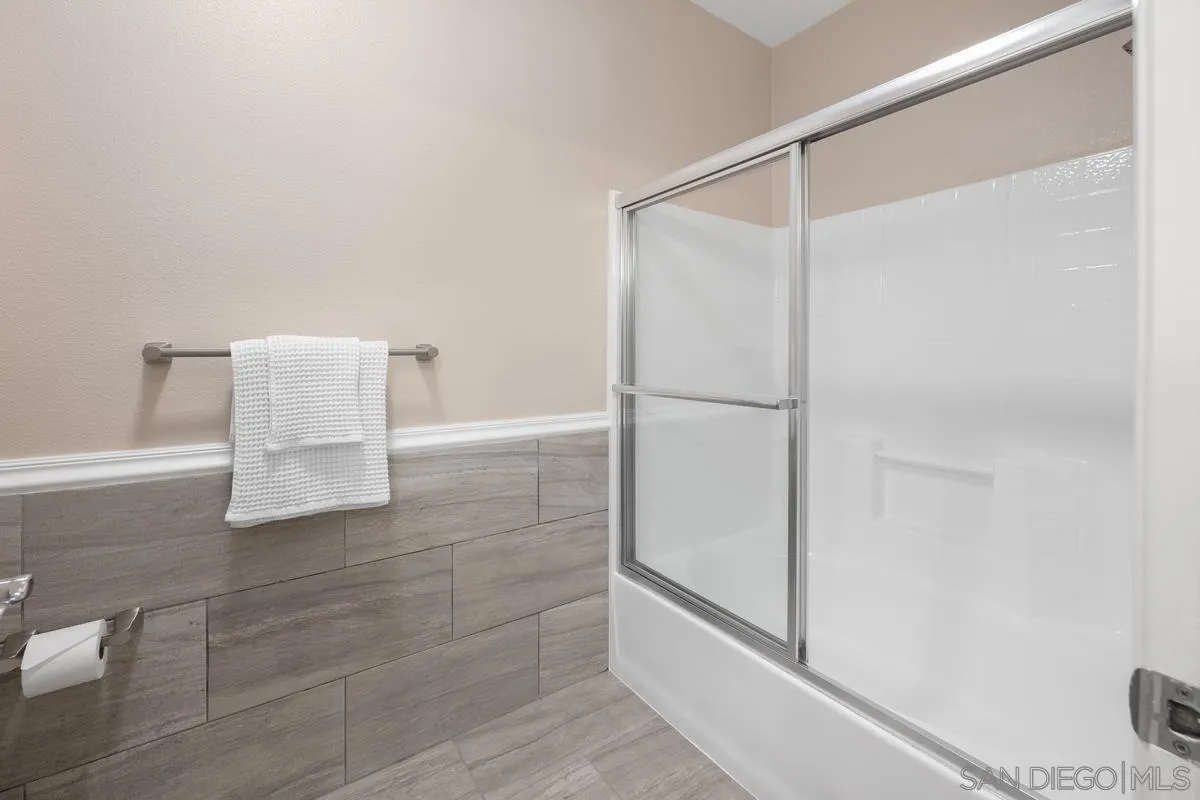 9229 Regents Road, Unit L124 La Jolla, CA 92037 - Photo 18 of 46 a bathroom with a shower and a glass door