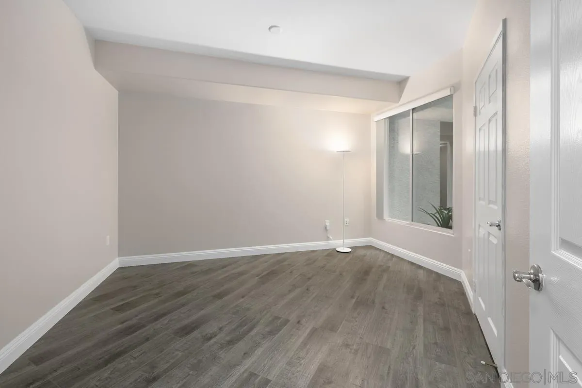 9229 Regents Road, Unit L124 La Jolla, CA 92037 - Photo 23 of 46 a view of an empty room with wooden floor