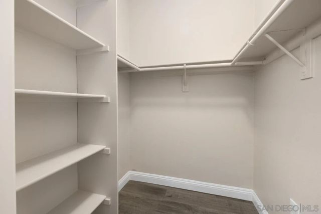 a bathroom with a sink toilet a mirror and shower