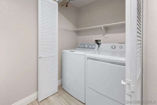 a building with glass table and chairs