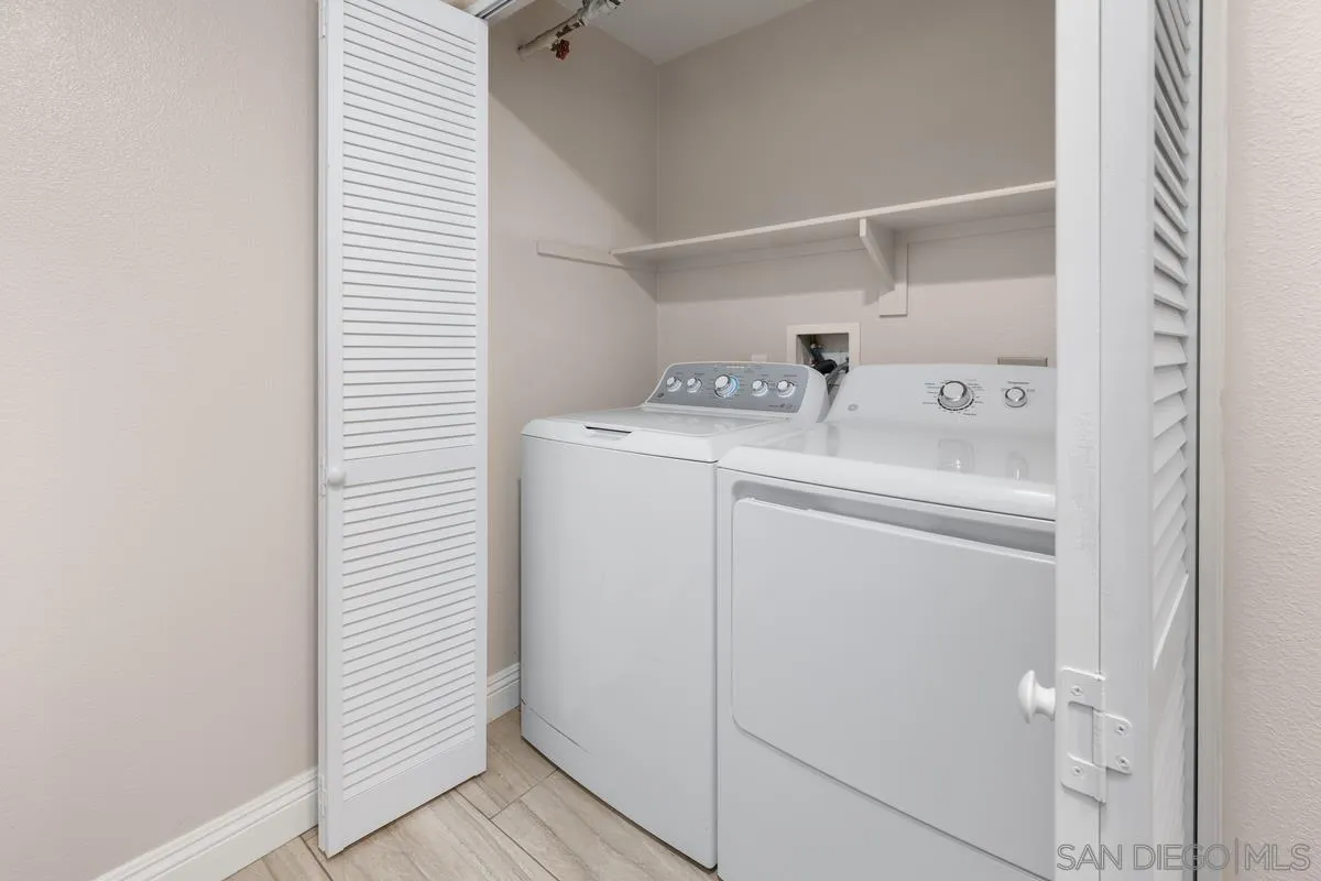 9229 Regents Road, Unit L124 La Jolla, CA 92037 - Photo 27 of 46 a utility room with dryer and washer