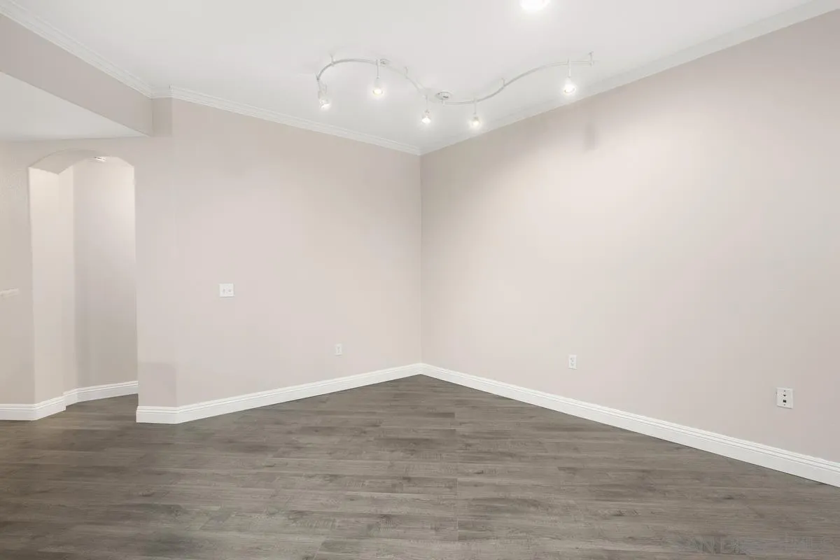 9229 Regents Road, Unit L124 La Jolla, CA 92037 - Photo 8 of 46 a view of an empty room with wooden floor