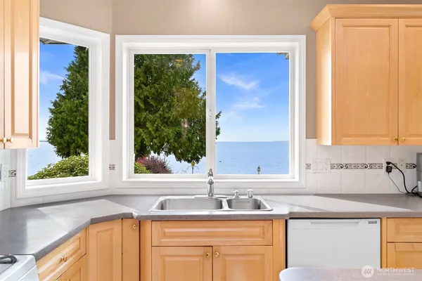 a kitchen with a sink and a window