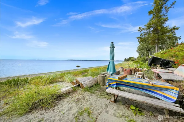 a wooden bench sitting in the middle of a lake