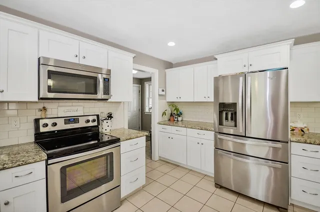 a living room with furniture dining table and a couch