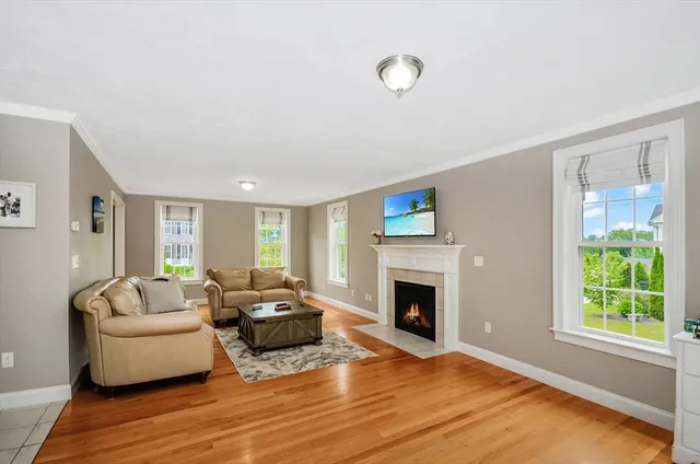 a view of a dining room with furniture wooden floor and chandelier
