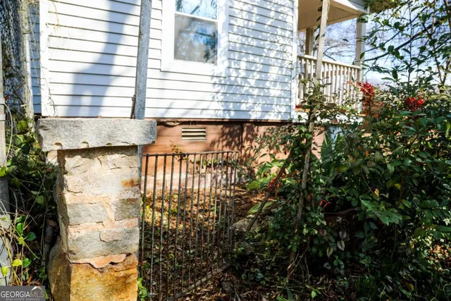 a front view of a house with a yard and outdoor seating