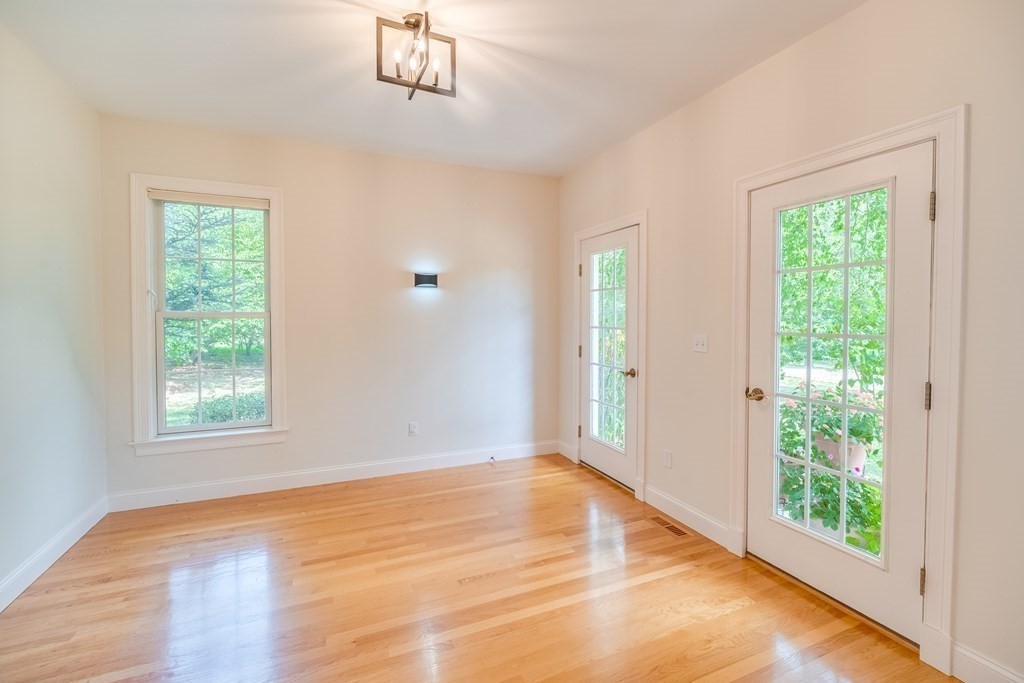 51 Linseed Road Northampton, MA 01060 - Photo 14 of 42 a view of an empty room with wooden floor and a window