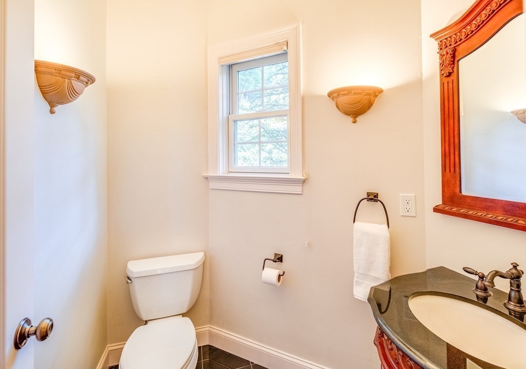 51 Linseed Road Northampton, MA 01060 - Photo 15 of 42 a bathroom with a sink a toilet and mirror