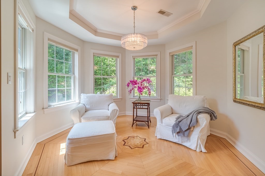 51 Linseed Road Northampton, MA 01060 - Photo 30 of 42 a living room with furniture a window and a chandelier