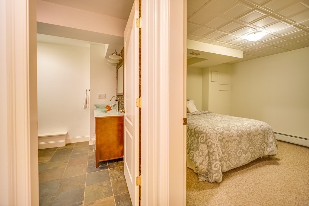 51 Linseed Road Northampton, MA 01060 - Photo 36 of 42 a bathroom with a tub shower and a sink
