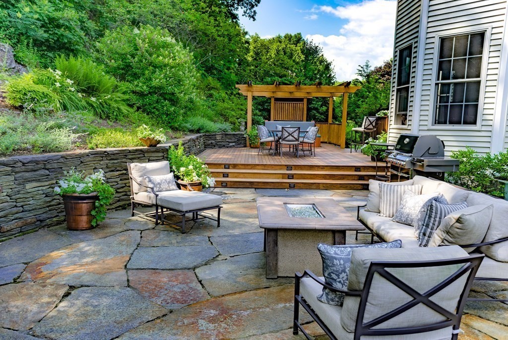 51 Linseed Road Northampton, MA 01060 - Photo 5 of 42 a view of a patio with couches table and chairs and potted plants