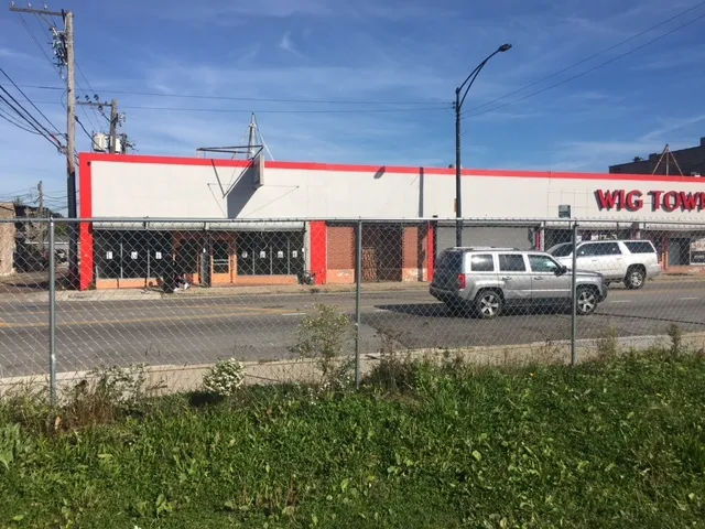 a view of a street with a building in the background