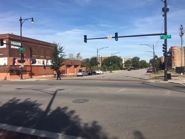a view of a street with cars