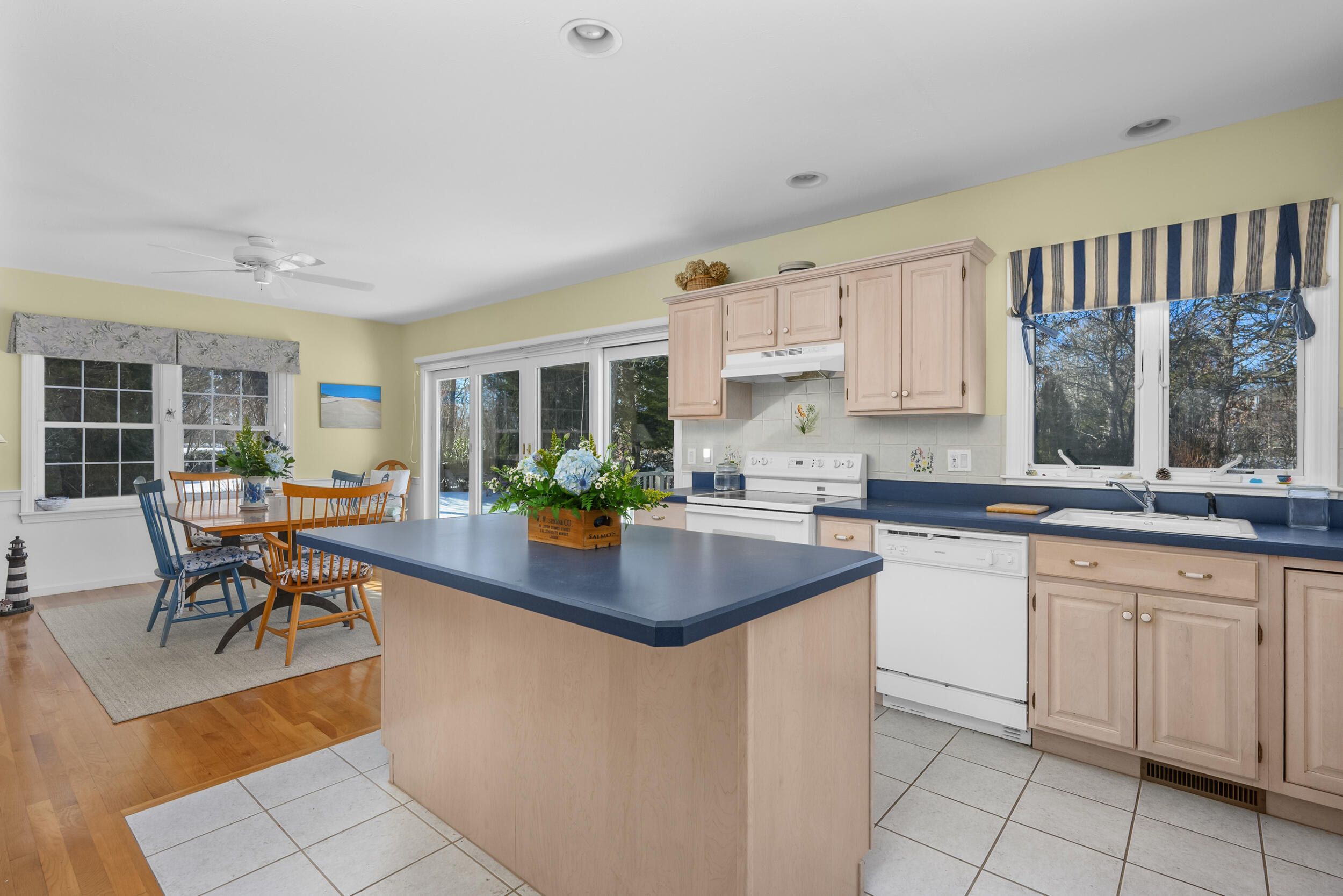 39 Jedidiah Way Chatham, MA 02633 - Photo 17 of 47 a kitchen with sink cabinets and dining table chair