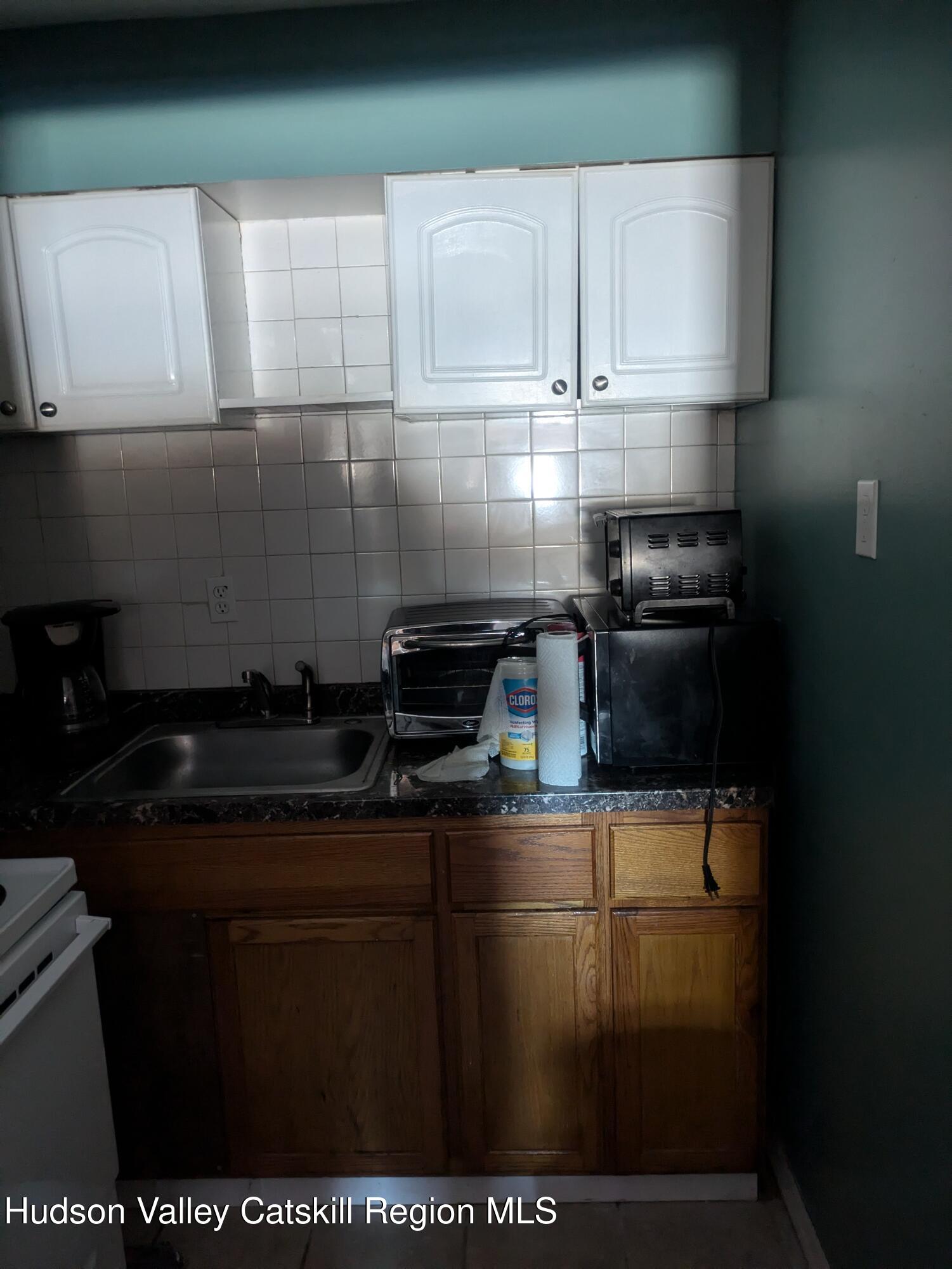 57 Samsonville Road Kerhonkson, NY 12446 - Photo 15 of 25 a kitchen with a sink and cabinets