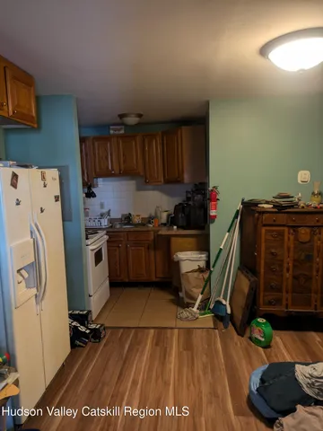 a kitchen with a refrigerator and cabinets