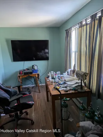 a room with furniture and a flat screen tv