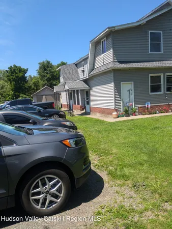 a view of a house with backyard