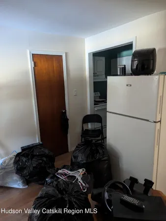 a kitchen with a refrigerator and a stove
