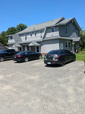 a car parked in front of a big room