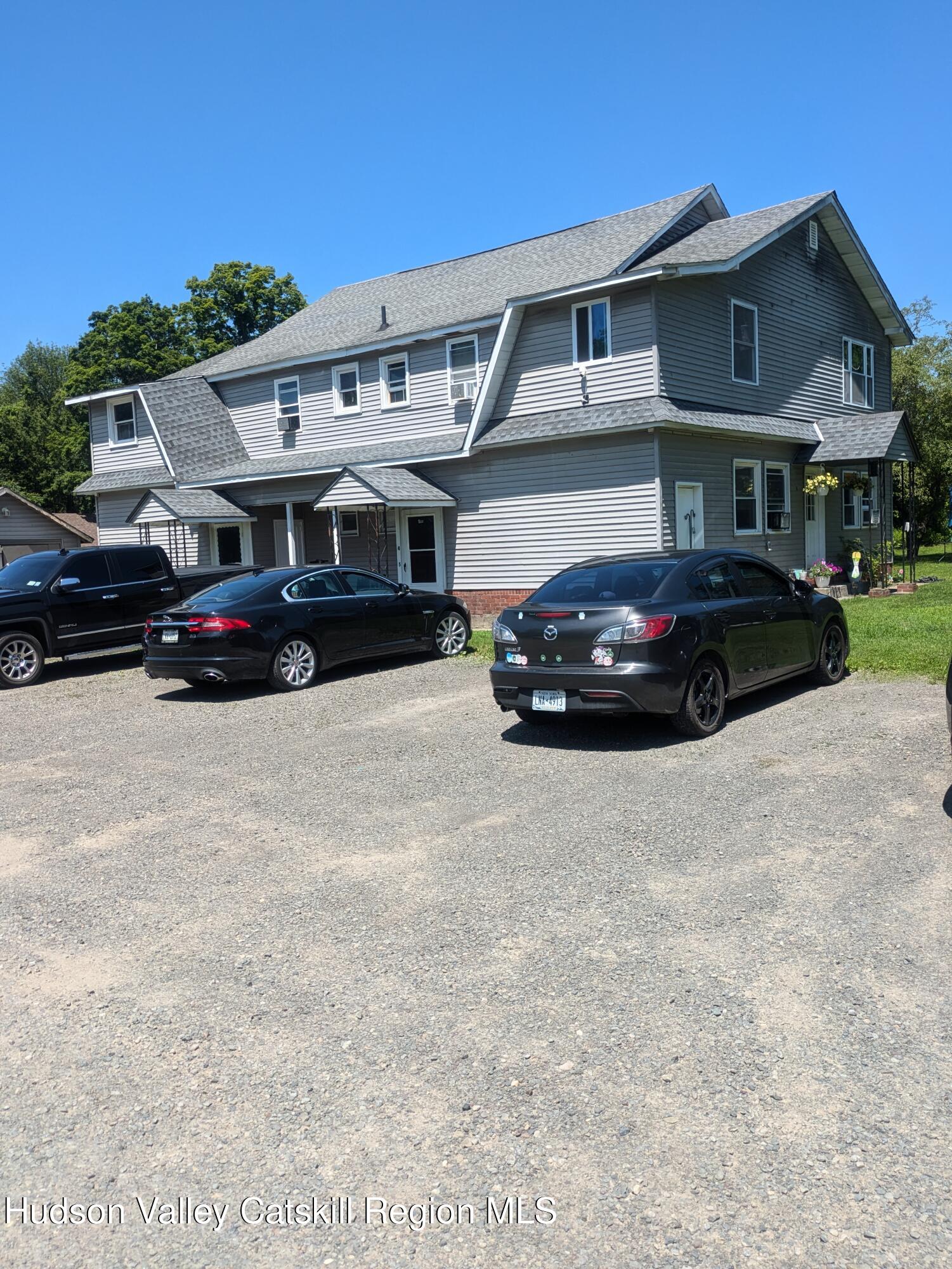 57 Samsonville Road Kerhonkson, NY 12446 - Photo 5 of 25 a car parked in front of a big room