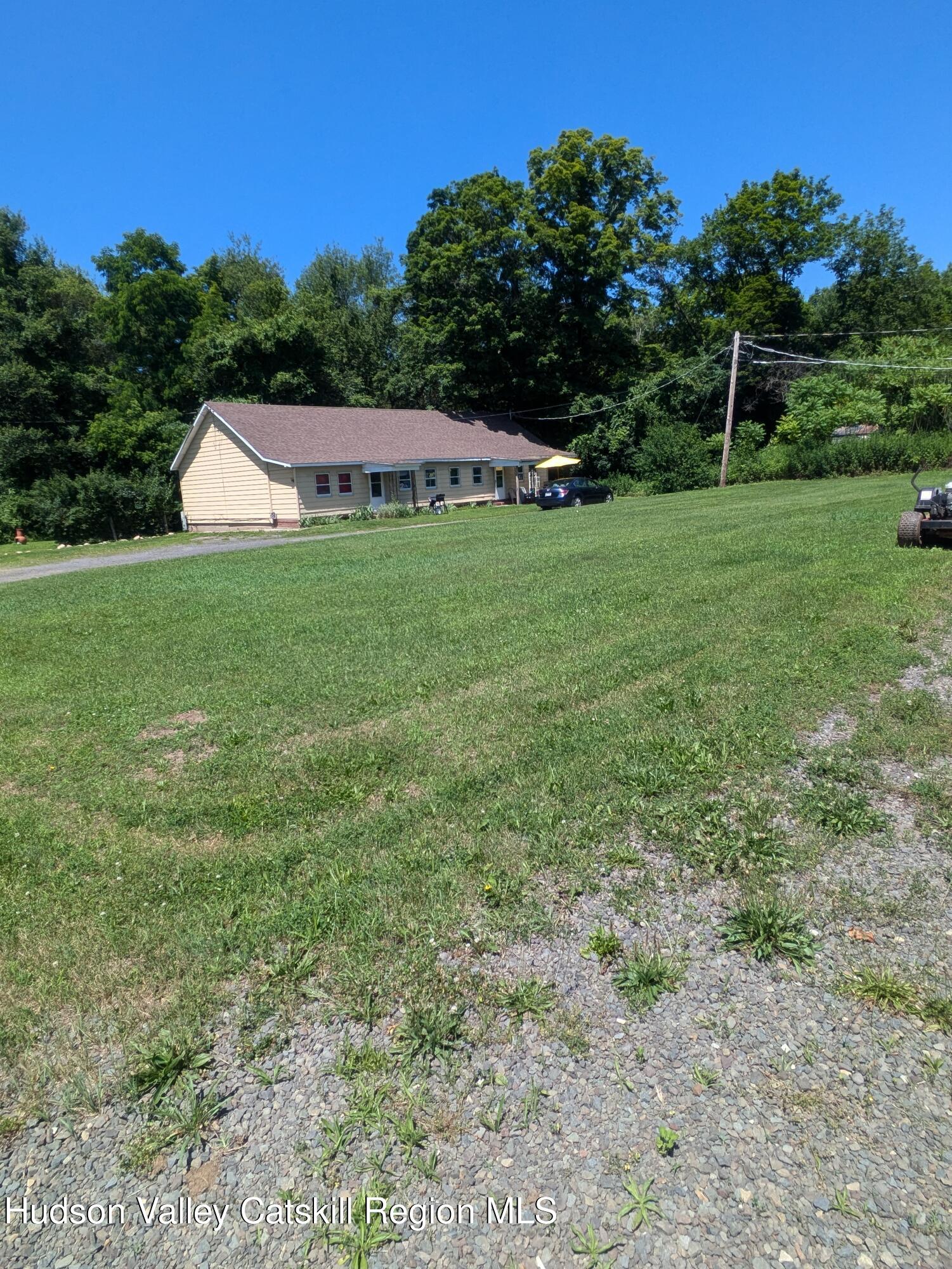 57 Samsonville Road Kerhonkson, NY 12446 - Photo 9 of 25 a view of a house with a yard and sitting area