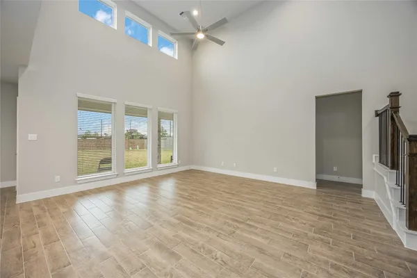 a spacious bedroom with a bed and a window