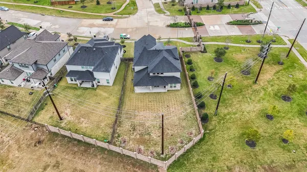 a view of a swimming pool with a yard