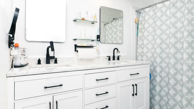 a bathroom with a sink vanity and mirror