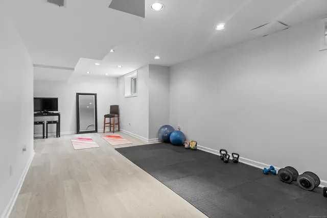 a large bedroom with a bed and a television