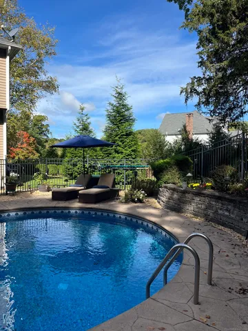 a view of a swimming pool with a patio