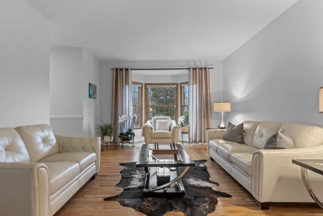 a living room with furniture or couch and a large window