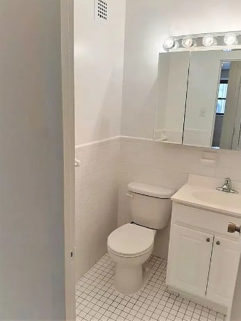 350 West 51st Street, Unit 3H Manhattan, NY 10019 - Photo 7 of 8 a bathroom with a toilet and a sink