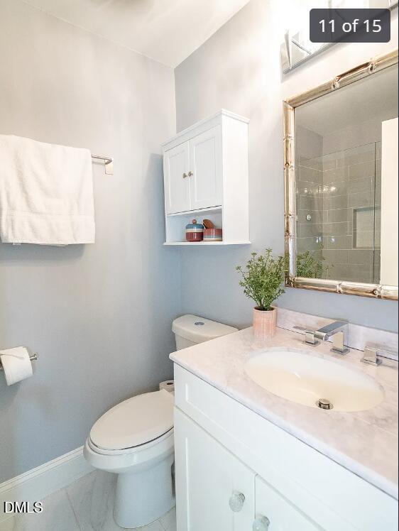 633 Stacy Street Raleigh, NC 27607 - Photo 11 of 17 a bathroom with a sink toilet and mirror