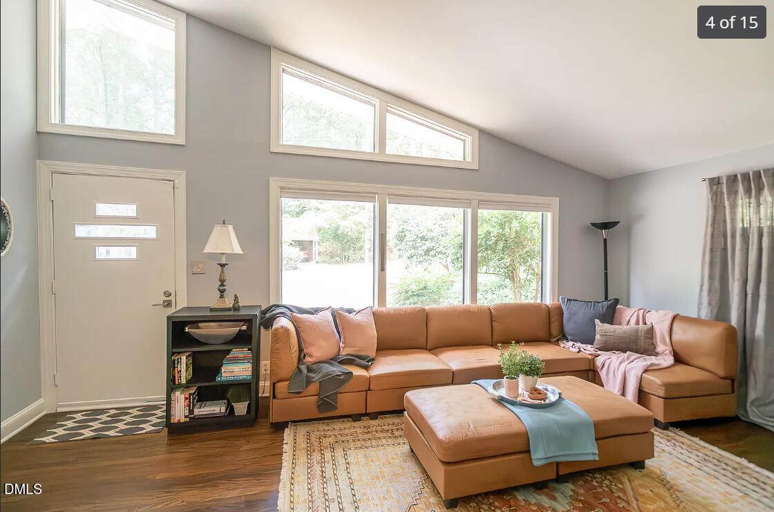 633 Stacy Street Raleigh, NC 27607 - Photo 4 of 17 a living room with furniture and a large window