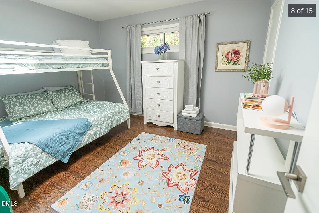 633 Stacy Street Raleigh, NC 27607 - Photo 8 of 17 a bedroom with a bed and furniture