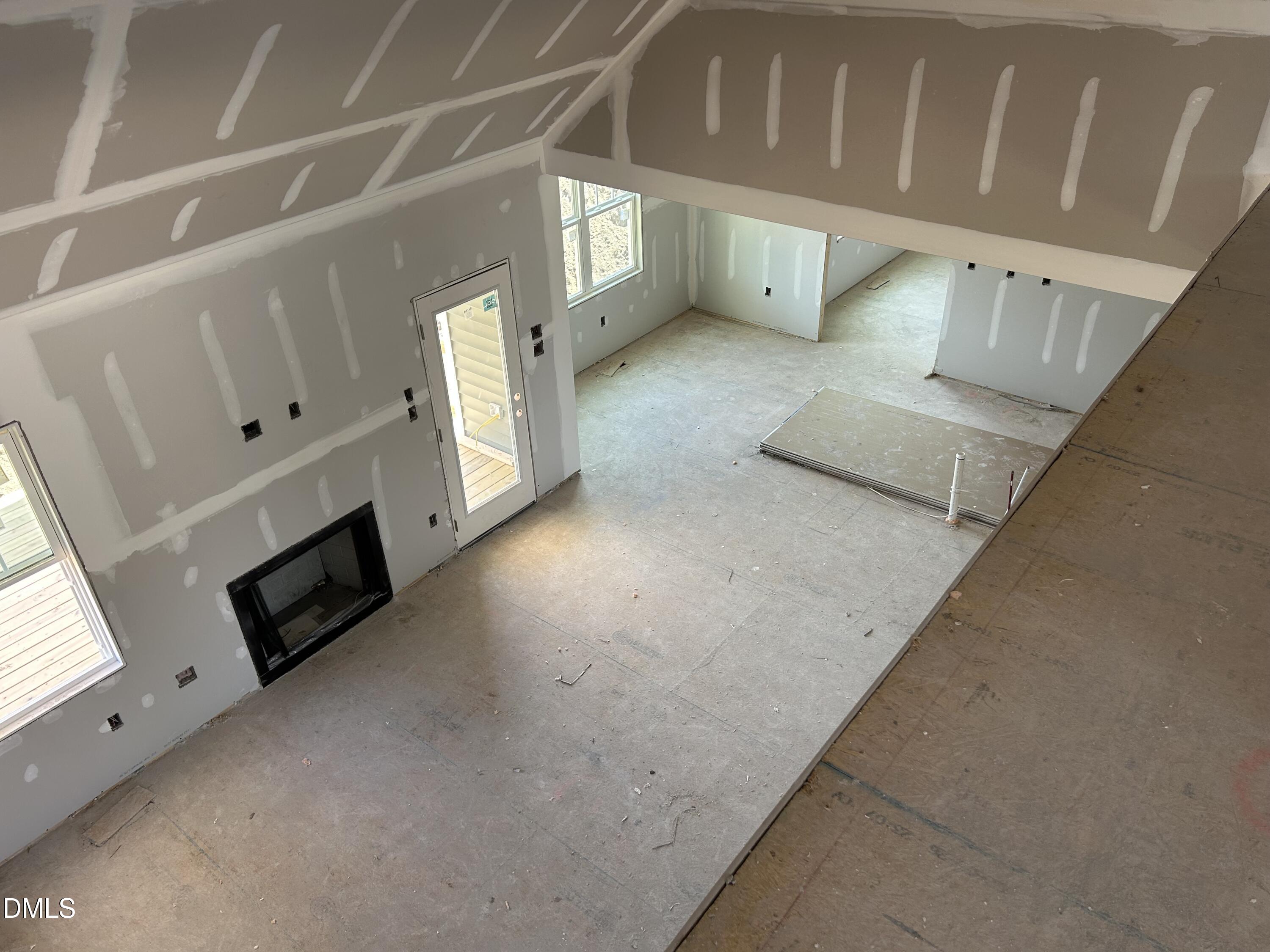 168 Prency Lane Middlesex, NC 27557 - Photo 4 of 15 a view of an empty room with a fireplace and a window
