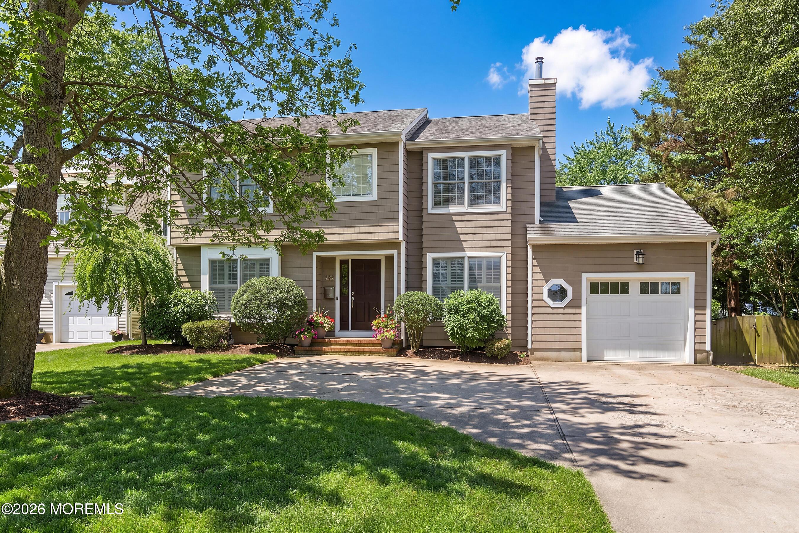 924 Ocean Road Point Pleasant, NJ 08742 - Photo 2 of 56 a front view of a house with a garden