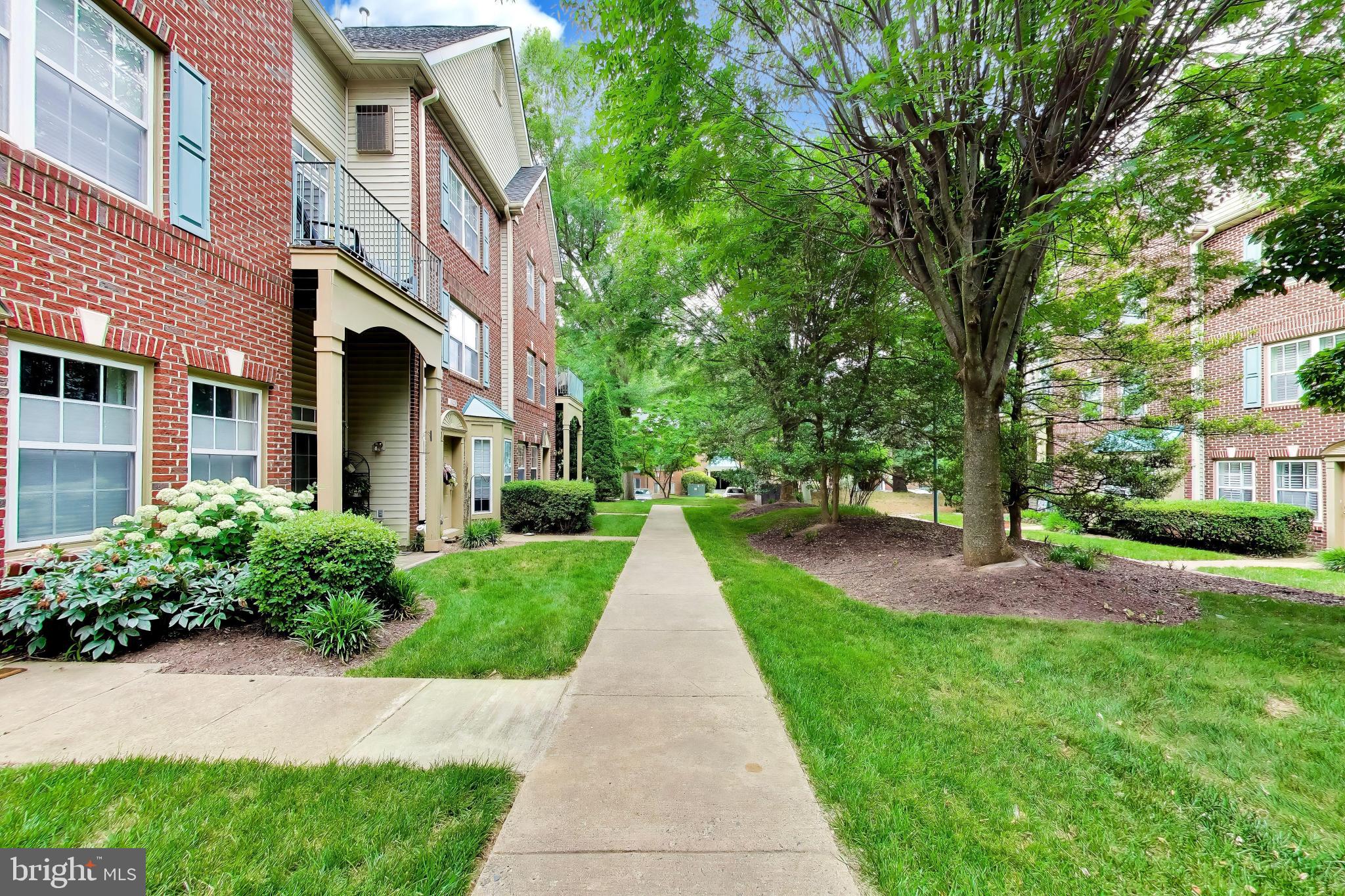 11830 Breton Court, Unit 23B Reston, VA 20191 - Photo 6 of 43 Lush pathways in a serene community.
