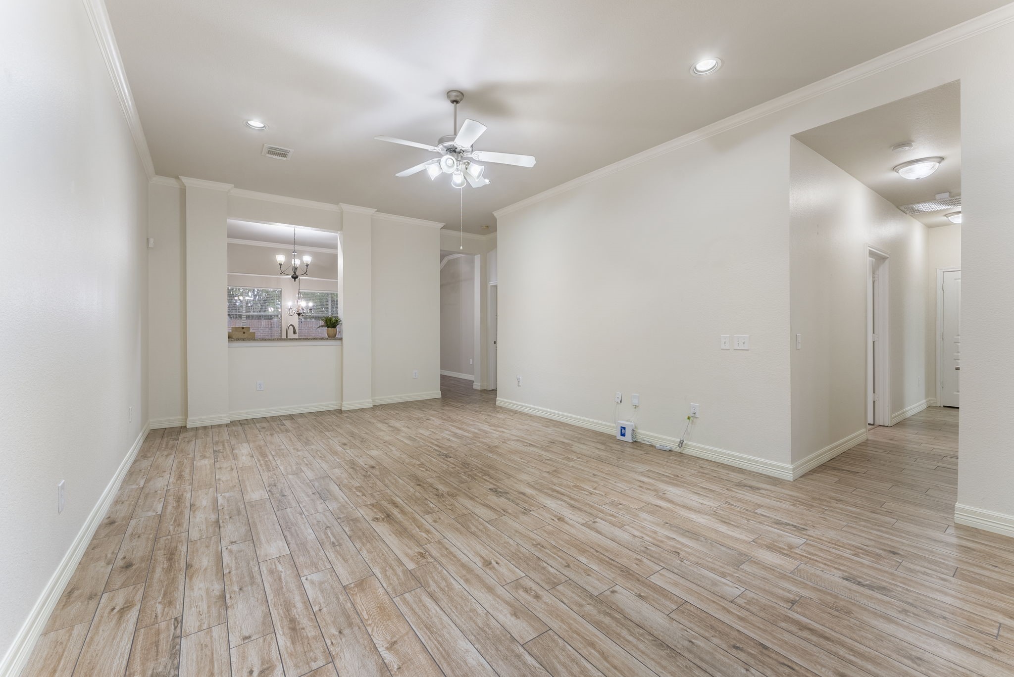 9622 Old Timber Lane Spring, TX 77379 - Photo 10 of 50 an empty room with wooden floor and windows