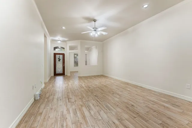 a kitchen with a refrigerator and a stove top oven