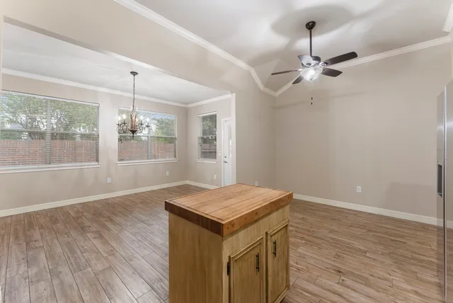 a view of a house with yard and a garden