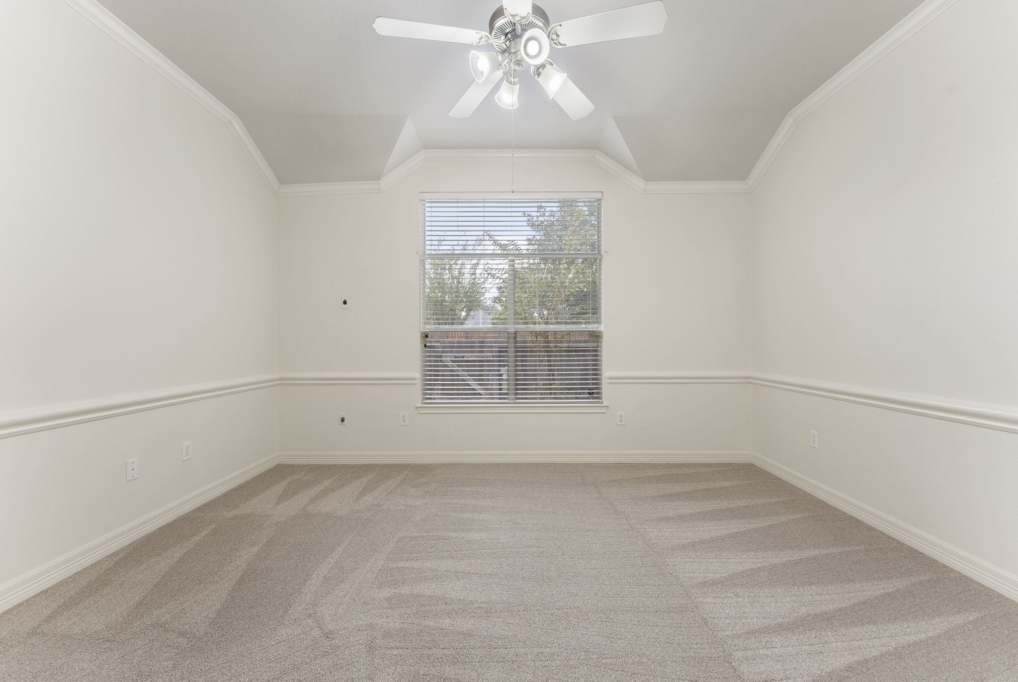 9622 Old Timber Lane Spring, TX 77379 - Photo 36 of 50 an empty room with a chandelier fan and windows